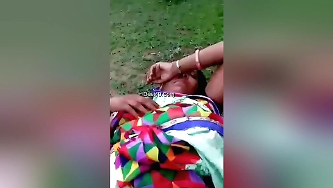 Brunette girl with natural tits is making love outdoors