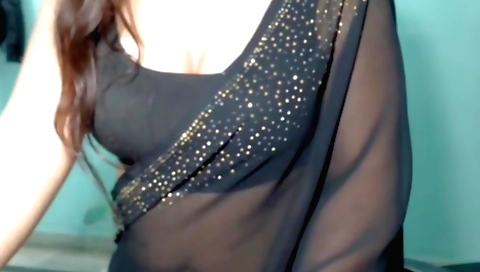 Indian girl is wearing a sexy dress and dancing with her body