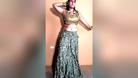 Indian girl with big tits and shaved pussy enjoys dancing