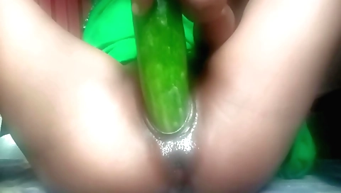 Indian solo girl masturbates with a small cucumber toy