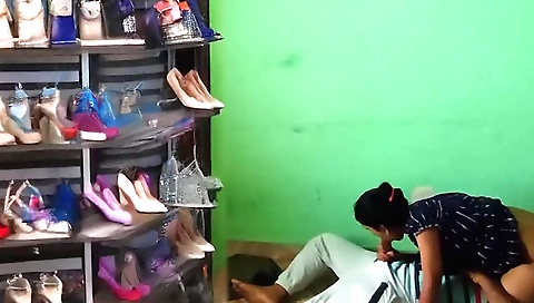 Indian brunette has her hands on her shaved pussy to show a video