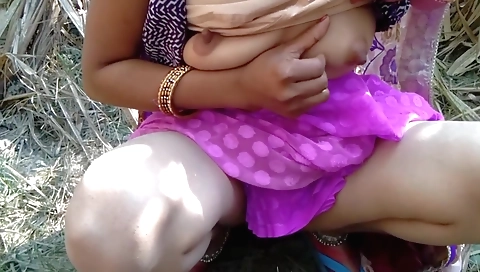 Indian woman with hairy pussy touches herself outdoors