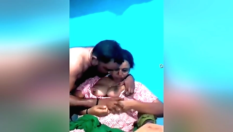 Indian wife with huge boobs sucking on her husband's dick
