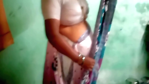 Busty indian brunette in white blouse and a black skirt