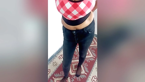 Mature indian woman in sexy white dress in the bedroom