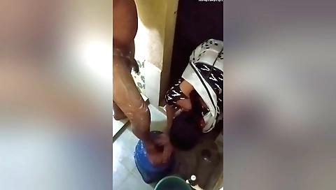 Amateur brunette in the bathroom giving me a handjob